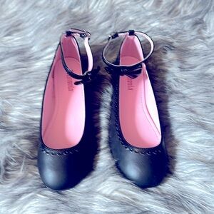 Black Demonia ballet slippers with patent leather bow. Size 8.